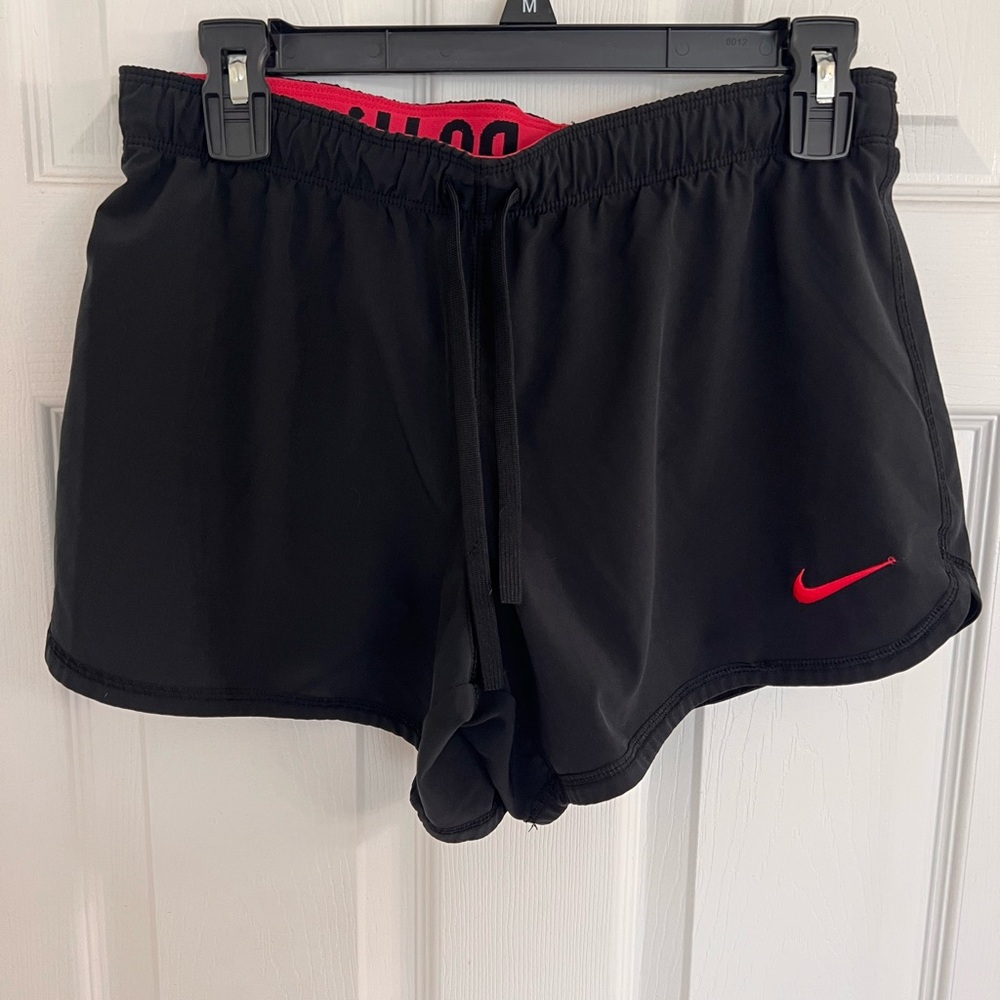Nike Small shorts with built in shorts underneath and drawstring.